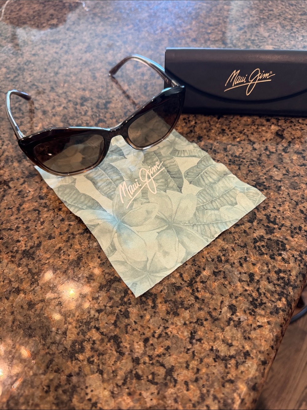 Maui Jim Women’s Tortoiseshell Cat-Eye Sunglasses with Dark Lenses. Lotus style